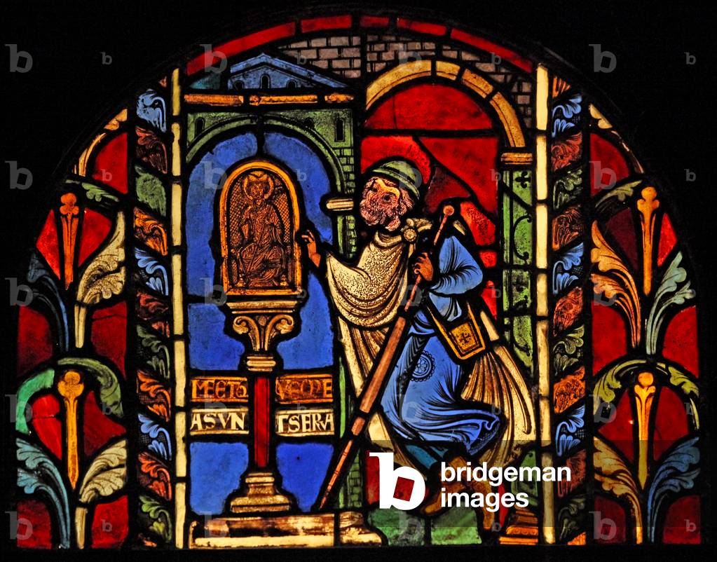 Depicting a scene from the Life of St Nicholas, ex Troyes Cathedral: a borrower has lost his money and goes to the statue of St Nichoas, who oversees such matters (stained glass)