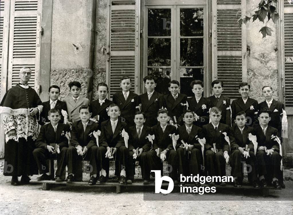 Group of first communicants boys with a priest, Caunes Minervois,1948 (photo)