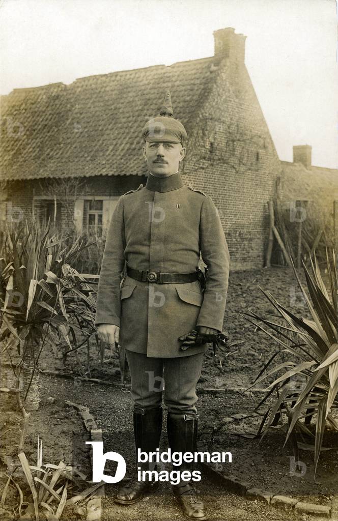 German soldier in uniform with a pointed helmet in front of his house - original photographic print of 1915- First World War 14-18 (1914-1918) - German army -