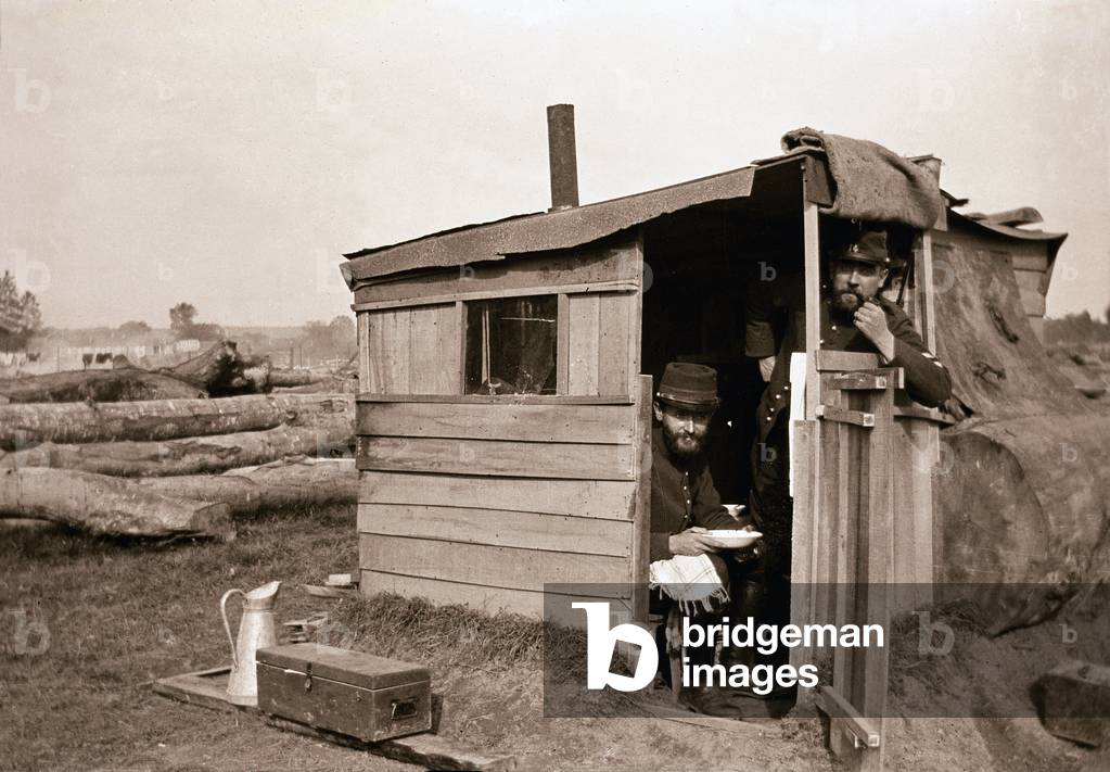 First World War 1914-1918 (14-18): French soldiers (hairy) in their hut or “cagna” (makeshift shelter in or near the trench, made of recuperation materials) - trench - front - negative anonymous photographic, private collection -