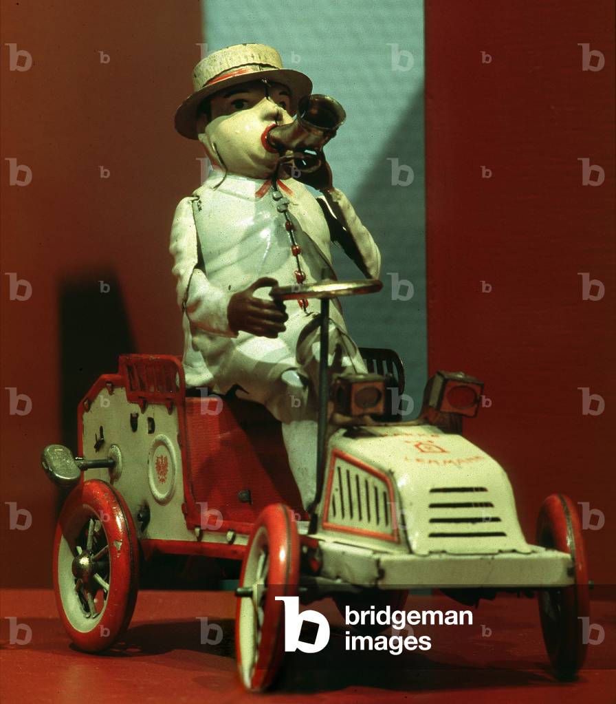 German toy automaton from 1913: character driving a tin car, whose mechanics can be traced by means of a key. Canet Toy Museum (Eastern Pyrenees, 66) -