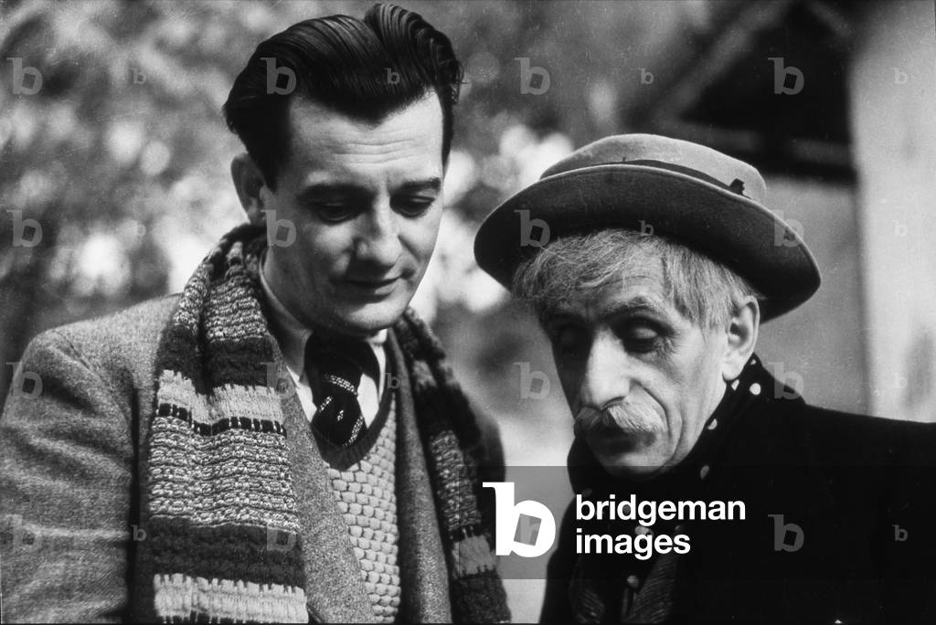 Marcel Pagnol, writer and cineaste in 1933, leading his friend the composer Vincent Scotto, to whom he offered, for one of his few roles as a film comedian, the main role of the film Jofroi.