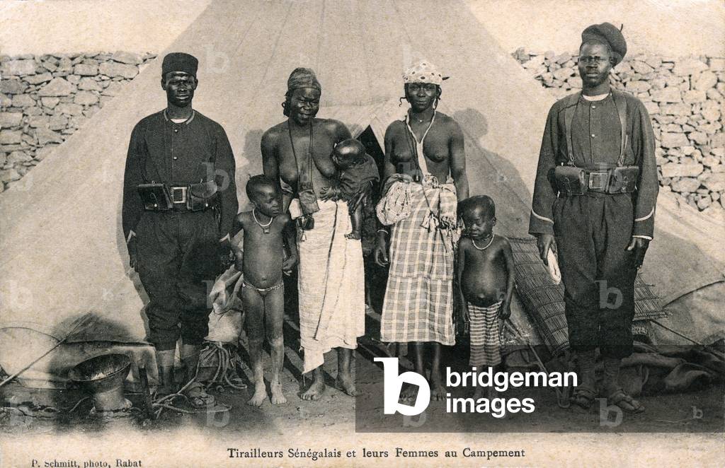 Senegalese riflemen with their children and wives at camp, Morocco, c.1910 (b/w photo)