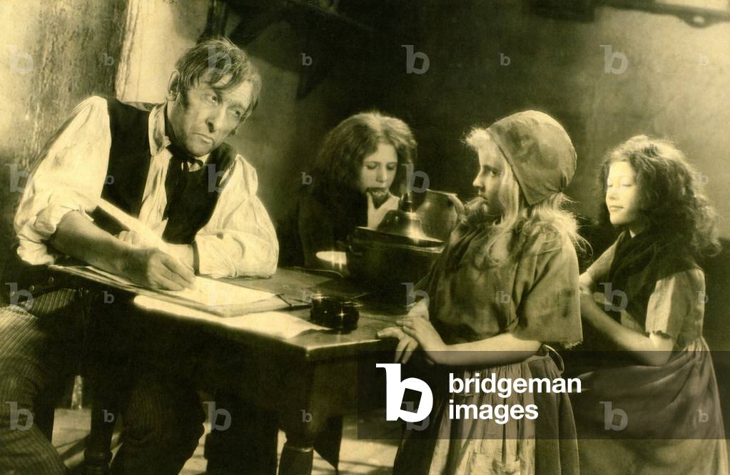 A scene from Raymond Bernard's film “The Miserables”” (1933) based on Victor Hugo's novel. Thenardier (Charles Dullin), Cosette (Gaby Triquet) with Eponine and Azelma in the hostel. This view shows the oblique framing used extensively in this film. Exploitation photography Pathe Natan Cinema - View analogous views (19th engravings): GUT4574 and GUT4575 -