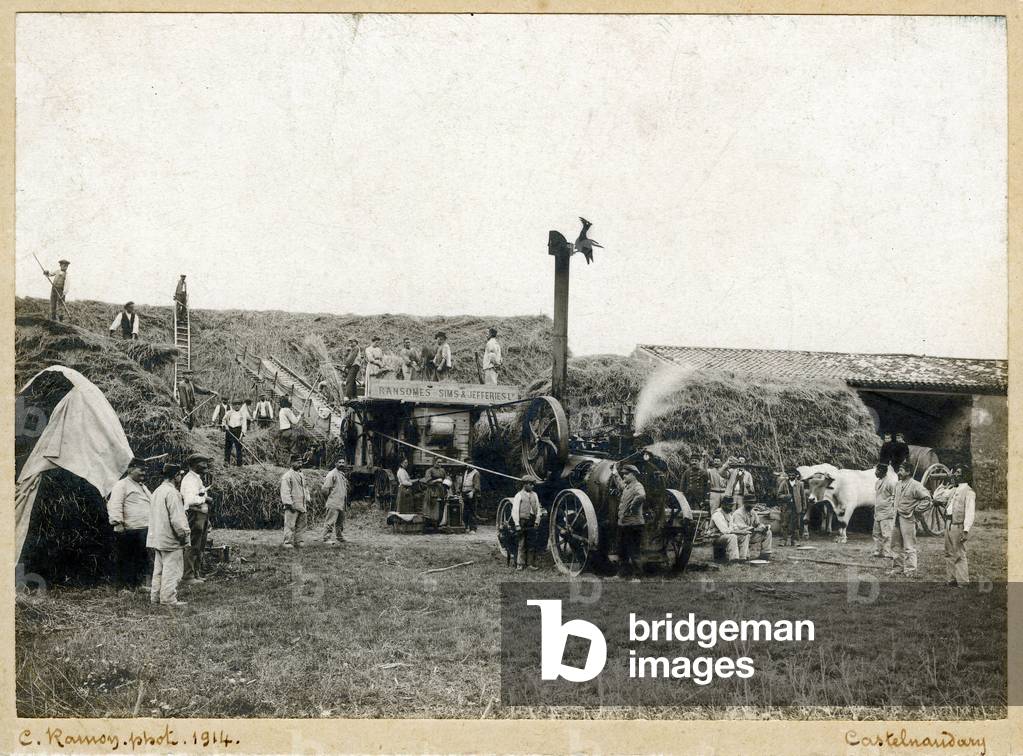 the locomobile, a steam thresher, in action in a farmyard in Languedoc in 1914. Note many soldiers present in the photo for this agricultural scene. The machine is branded Ransomes, Sims & Jefferies Ld. The cliche is signed by photographer Ramon, from Castelnaudary (Aude).