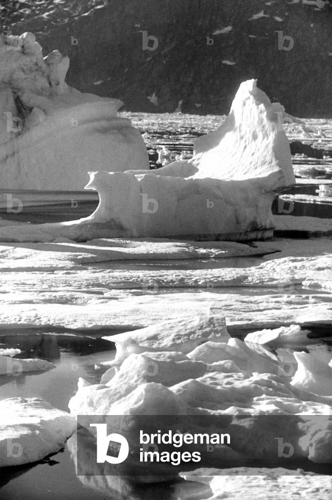 Breaking up of the ice floe in fjord of Kangerdlugssuatsiak, Greenland, Autumn, 1936 (b/w photo)