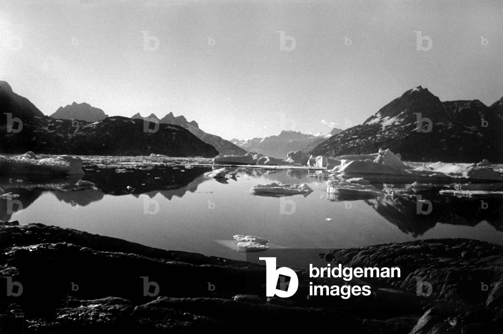 Fjord with icebergs, during polar expedition in Greenland, Kangerdlugssuatsiak, Autumn, 1936 (b/w photo)
