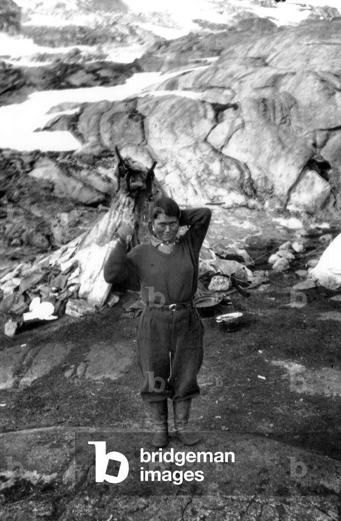 Doumidia, inuit companion of Paul-Emile Victor, wearing men cloths, during polar expedition in Greenland, Kangerdlugssuatsiak, Autumn, 1936 (b/w photo)