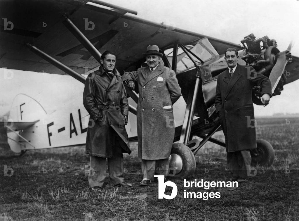Paul-Emile Victor (l, 1907-1995) french explorer and ethnologist, here at time of his participation in aerial Tour de France on a plane Potez 36, 1932 (b/w photo)