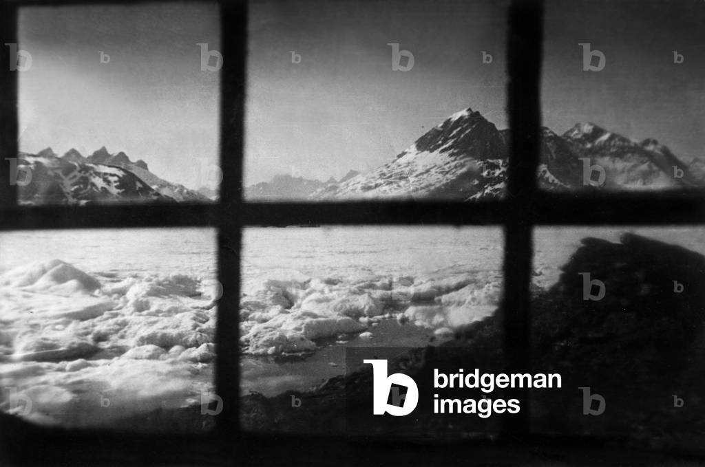 View of Kangerdlugssuatsiak fjord in Greeland from window of house of Paul-Emile Victor, during polar expedition in Greenland, Kangerdlugssuatsiak, Autumn, 1936 (b/w photo)