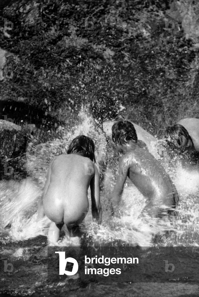 Inuits bathing in a lake, during polar expedition in Greenland, Kangerdlugssuatsiak, Autumn, 1936 (b/w photo)
