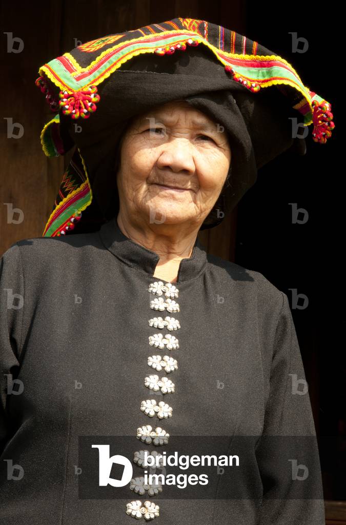 Thailand: Black Tai woman in traditional dress, Ban Na Pa Nat Tai Dam Cultural Village, Loei Province