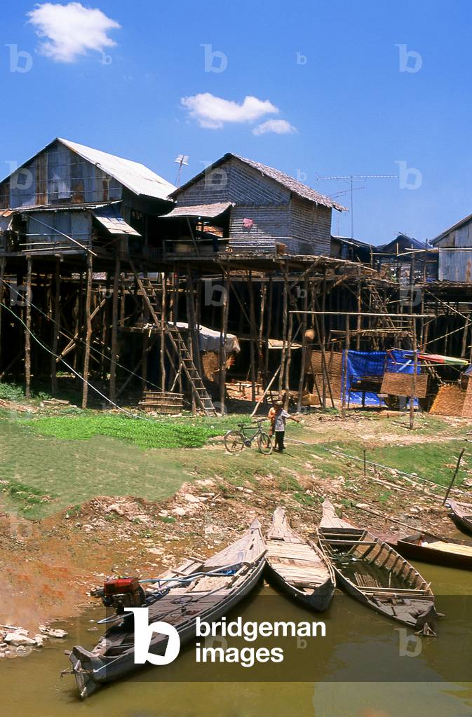 Cambodia: Stilted riverside housing (showing just how high the Tonle Sap River can rise), Kompong Chhnang