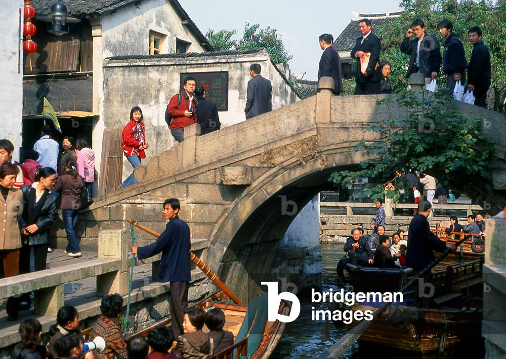 China: Bridge, boats and tourists in the 'Water Town' of Zhouzhuang, Jiangsu Province