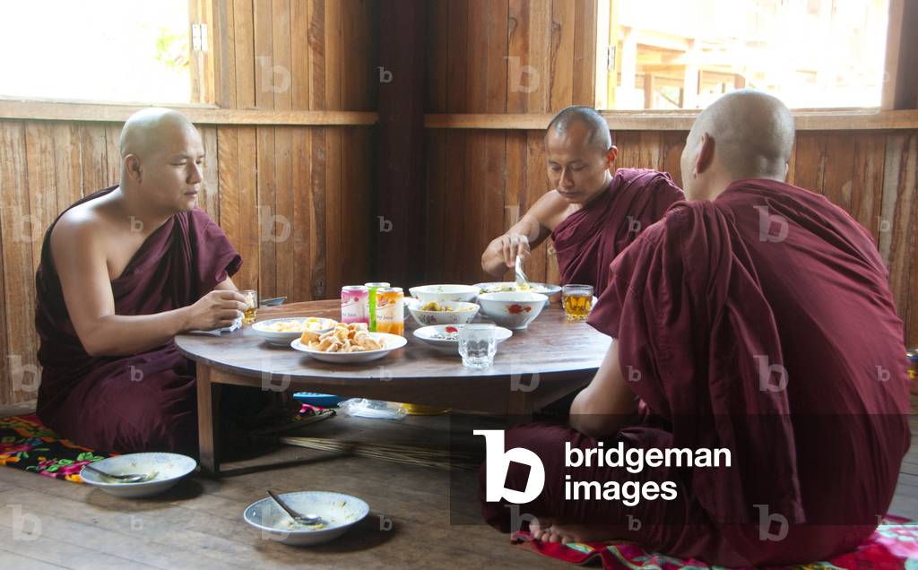 Burma-Myanmar: Buddhist monks eating their only meal of the day, before noon at the May Nigone Mon Monastery, Inle Lake