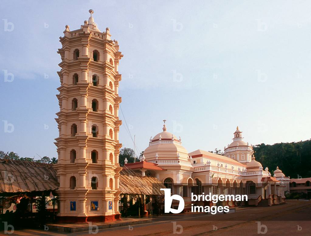 India: The lamp tower (Deep Stambha) and main temple buildings at the Shri Mangesh (Mangueshi) Temple, near Ponda, Goa