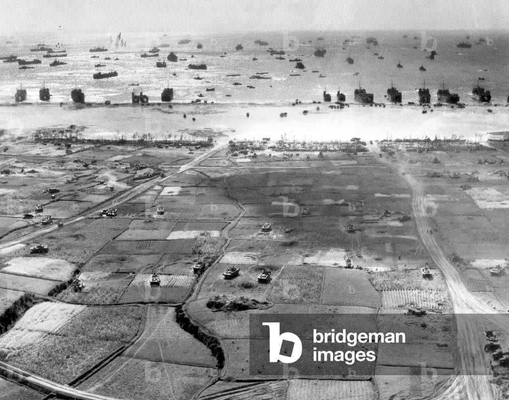 Japan / USA: Landing vehicles and tanks roll across terrain on Okinawa from beaches as Amphibious Task Force unloads. April 3, 1945. Battle of Okinawa (photo)