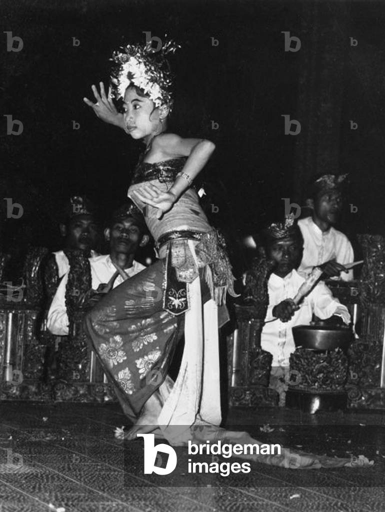 Indonesia: A legong dancer performs on the Island of Bali, c.1970.