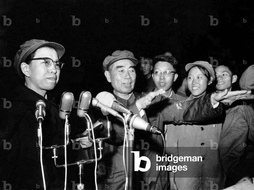 China: Zhou Enlai (1898 - 1976), Premier of the People's Republic of China (1949-1976) with Jiang Qing (Madame Mao, left) addressing 500,000 red guards at a mass rally in Tiananmen Square, Beijing, 31 August 1966