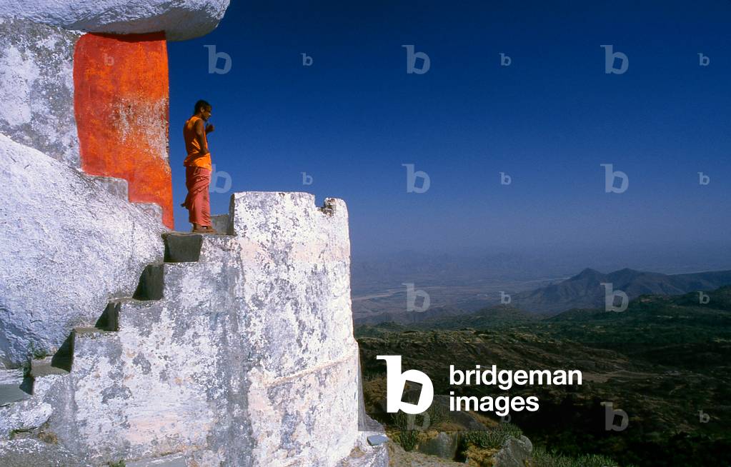 India: A swami surveys the scene from his hermitage, Mount Abu, Rajasthan