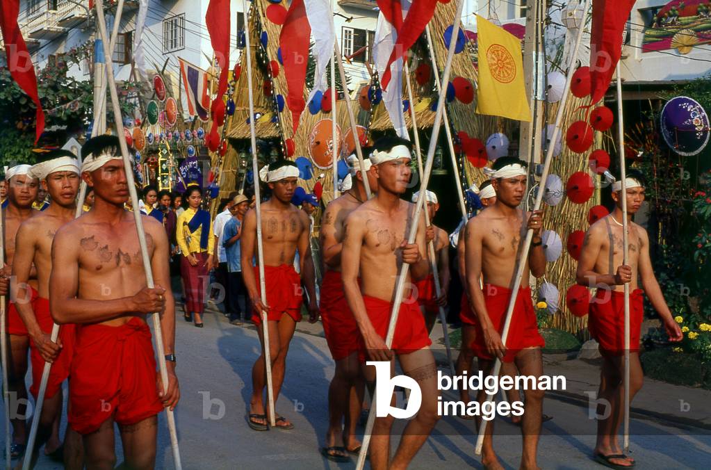 Thailand: Northern Thai men carrying tung banners in the Umbrella Festival parade, Bo Sang Umbrella Village, Chiang Mai, northern Thailand