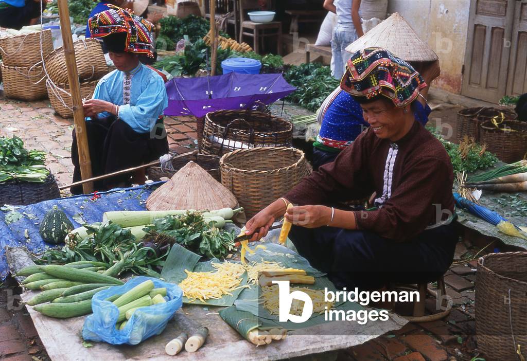Vietnam: Tai women selling vegetables in the market at Thuan Chau, Northwest Vietnam