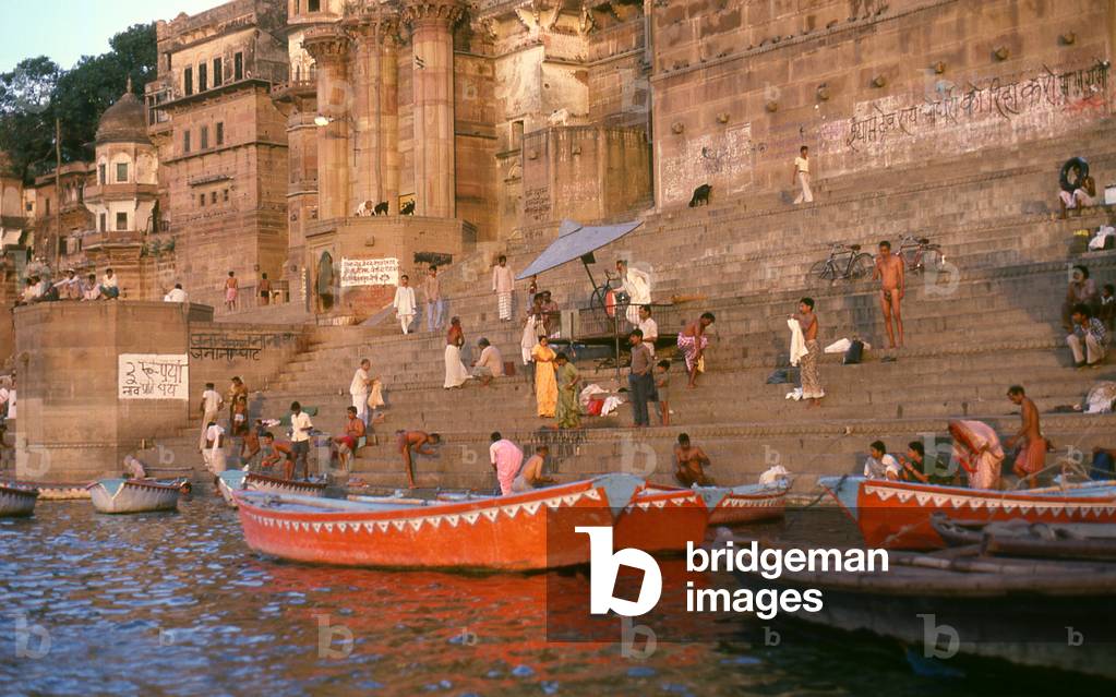 India: Early morning bathers ritually cleansing themselves in the River Ganges, Varanasi