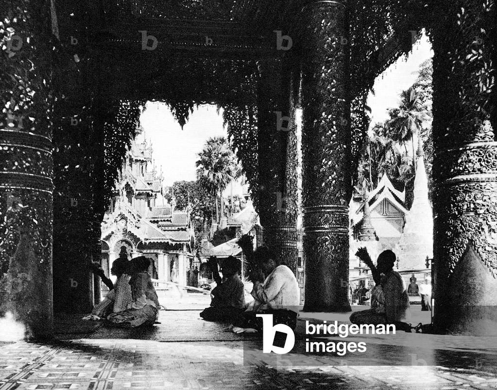 Burma/ Myanmar: Buddhists pray at Shwedagon Pagoda in Rangoon, c.1920s.