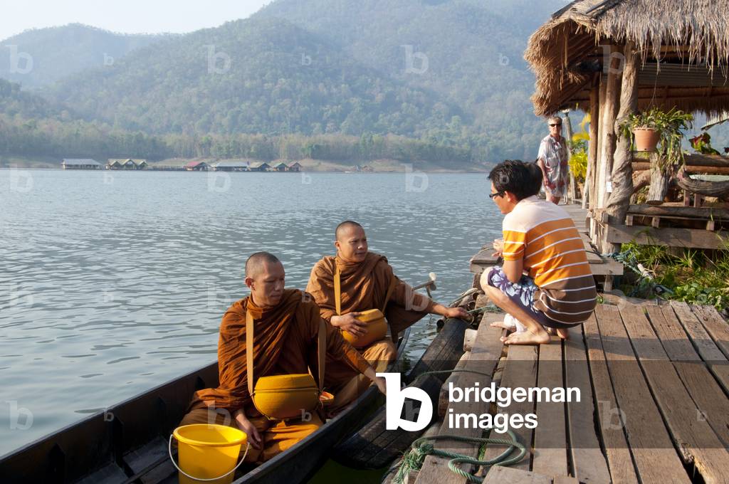 Thailand: Monks on their early morning almsround on the lake at the Mae Ngat Dam, near Chiang Mai, northern Thailand