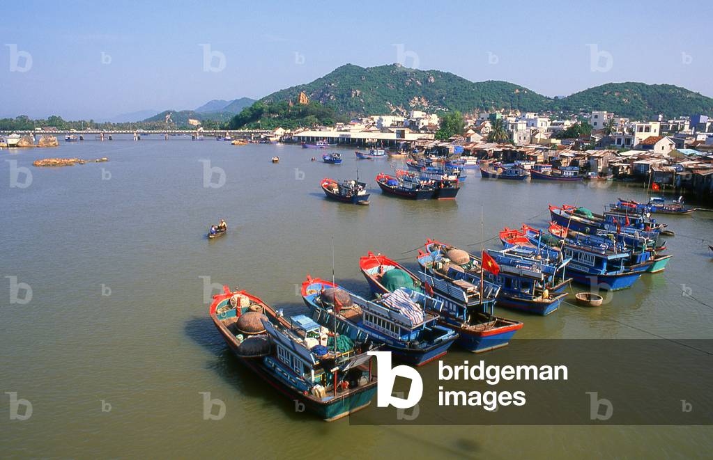 Vietnam: Fishing boats in the harbour, with the Po Nagar Cham Towers on the hill in the background, Nha Trang, Khanh Hoa Province