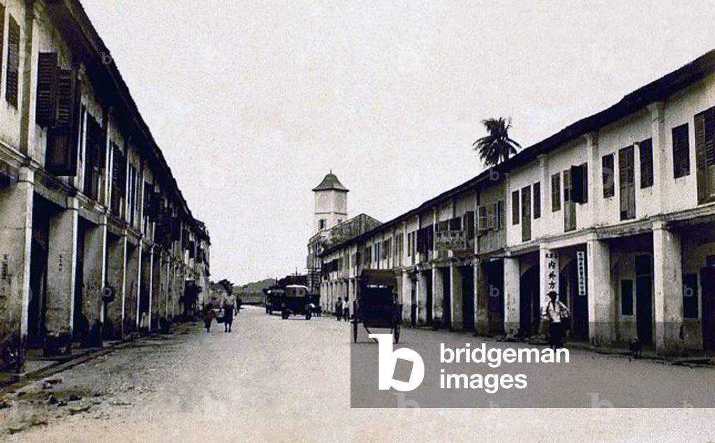 Thailand: A rickshaw and two cars on Phang Nga Road, Phuket, c. 1920