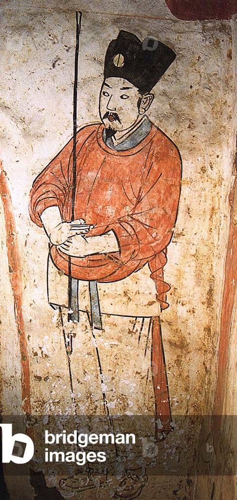 China: A doorkeeper in a mural in the tomb of Zhang Shiqing, Xuanhua, Hebei, Liao Dynasty (1093-1117).