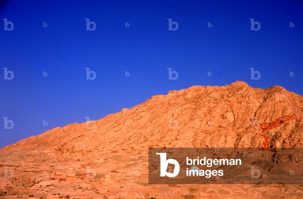 China: A tomb in the desert next to the Mausoleum of Mahmud al-Kashgari (Mahmud al-Kashgari Mazar) who compiled the first Turkic languages dictionary, Upar, Xinjiang Province