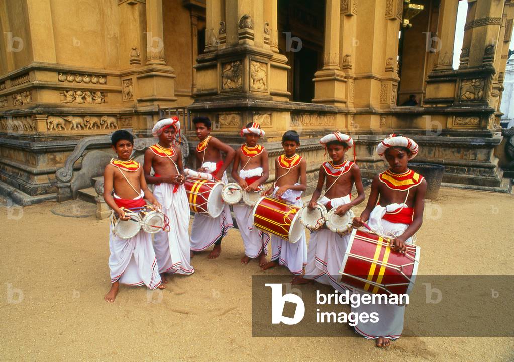 Sri Lanka: Traditional drummer boys at Kelani Temple near Colombo