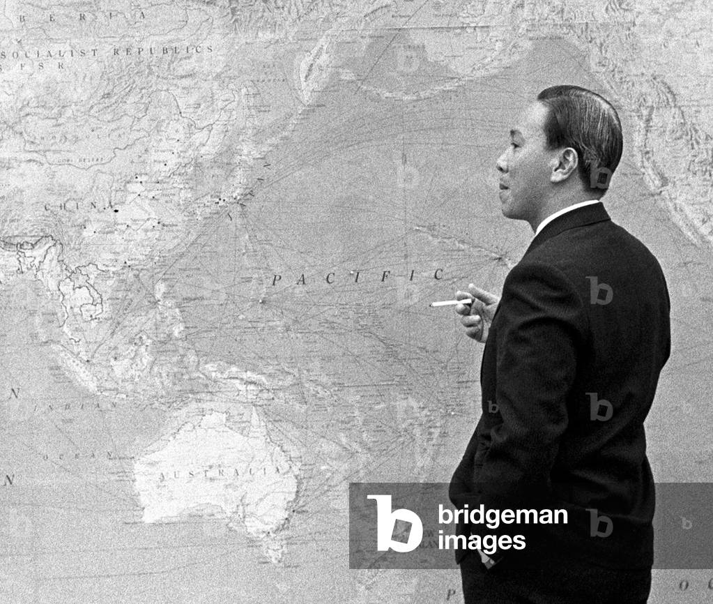 Vietnam: President Nguyen Van Thieu of South Vietnam standing in front of world map, during meeting with Lyndon B. Johnson in Hawaii (1968).