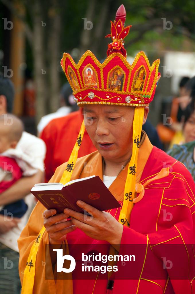 China: Elaborate late afternoon Buddhist rituals outside Ming-era Qianming Si (Qianming Temple), Guiyang, Guizhou Province