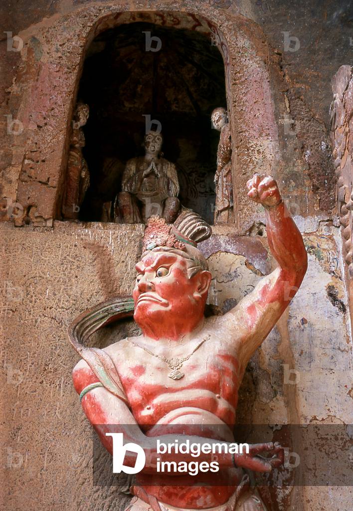China: Warrior statue protecting a cave, Maiji Shan Grottoes, Tianshui, Gansu Province