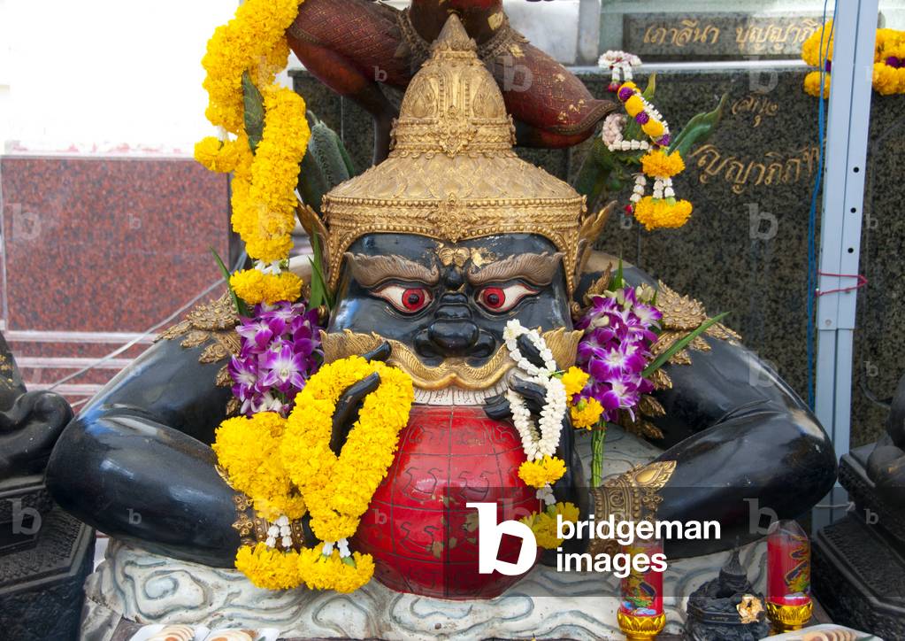 Thailand: A representation of Rahu (Snake Demon and causer of solar and lunar eclipses), swallowing the moon, Wat Traimit, Bangkok