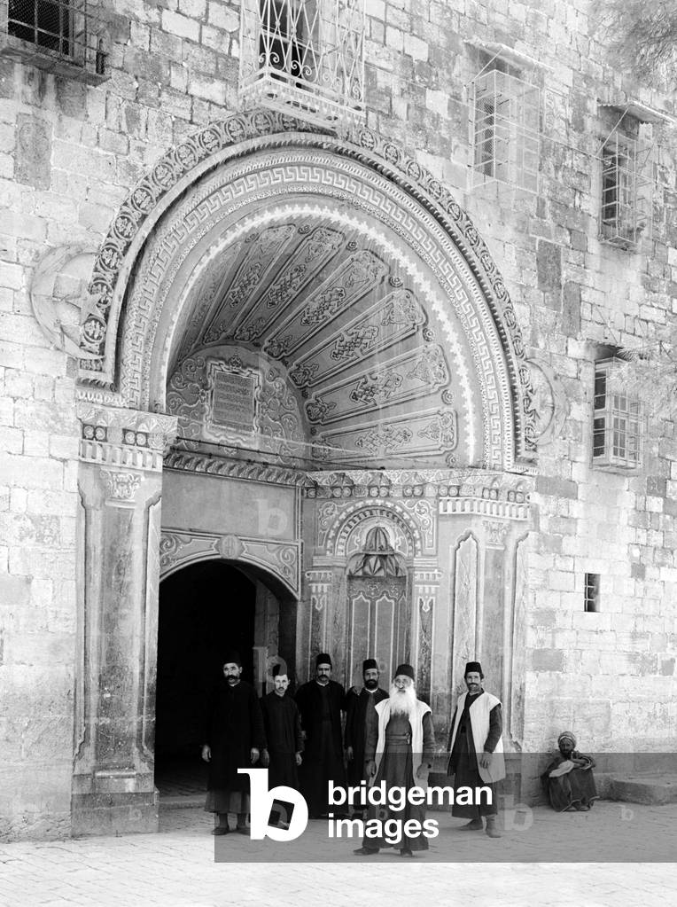 Palestine: Christian priests standing outside the entrance to the Armenian Convent, Jerusalem, c. 1910