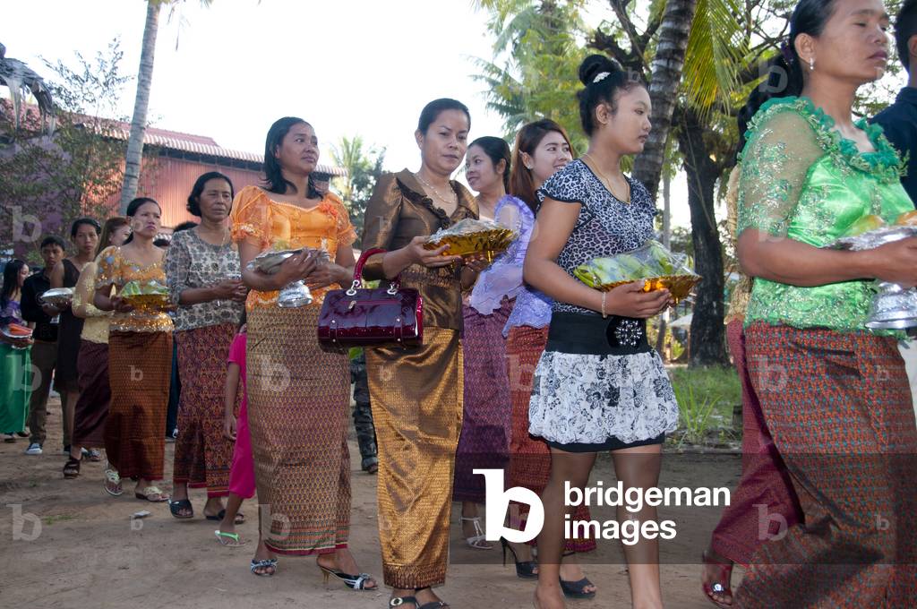 Cambodia: A wedding party arrives in the early morning at the home of the bride in a village near Siem Reap, central Cambodia (photo)