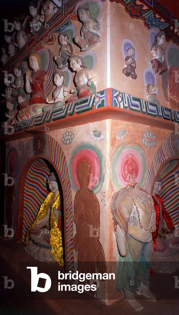 China: Buddha images within the dark recesses of the Dafo Si (Great Buddha Temple), Zhangye, Gansu Province