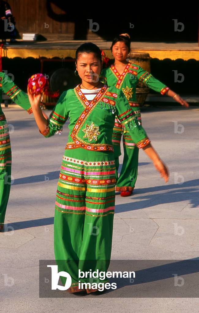 China: Young Zhuang women dancing at the Guangxi Provincial Museum, Nanning, Guangxi Province