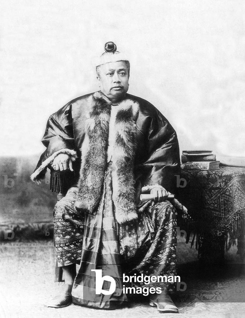 Burma / Myanmar: A Bamar official dressed in silk pasoe and fur jacket to indicate rank. Late 19th century