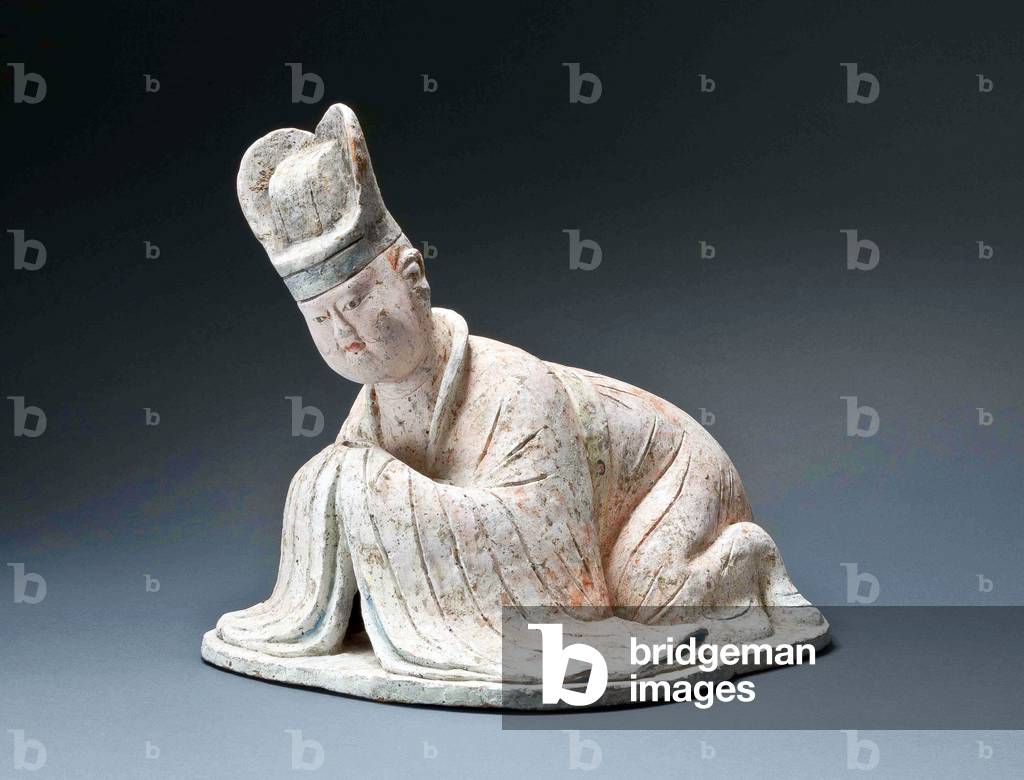 China: A painted pottery figure of a courtier kneeling in obeisance, Tang Dynasty (618-907), 8th century
