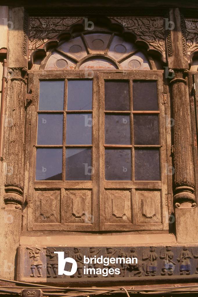 Nepal: A wooden frieze showing marching soldiers at the Tilang Ghar (Glass House), the first private residence in Kathmandu to be permitted to have glazed windows in the 19th century (1996)