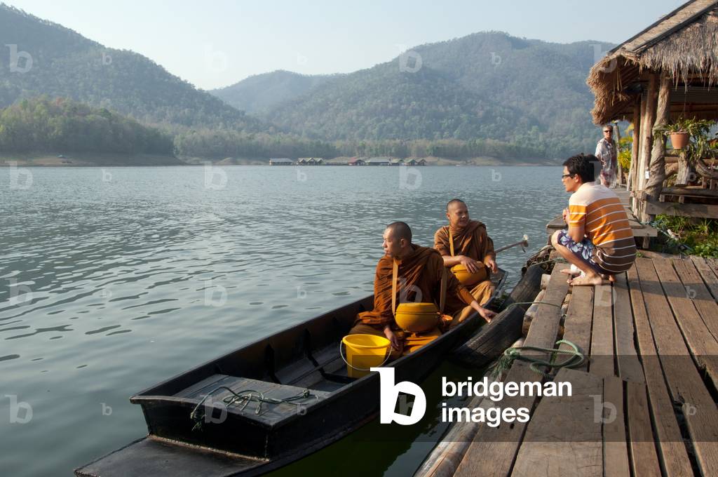 Thailand: Monks on their early morning almsround on the lake at the Mae Ngat Dam, near Chiang Mai, northern Thailand
