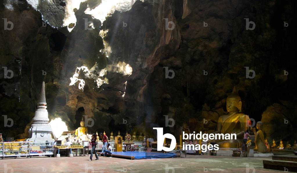 Thailand: Worshippers inside the main cavern at Tham Khao Luang, Phetchaburi