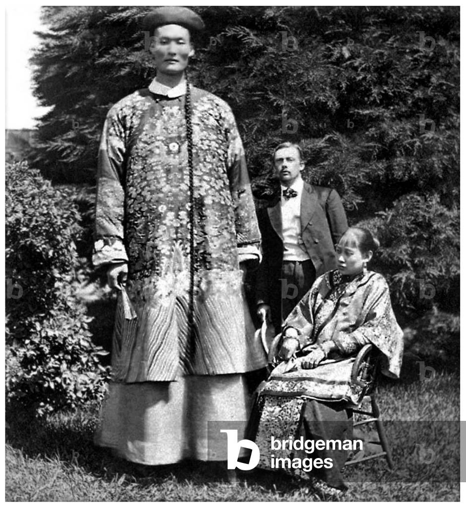 China: 'Chang the Chinese Giant' with a Chinese woman, probably his wife Kin Foo, and an unknown European, c. 1865
