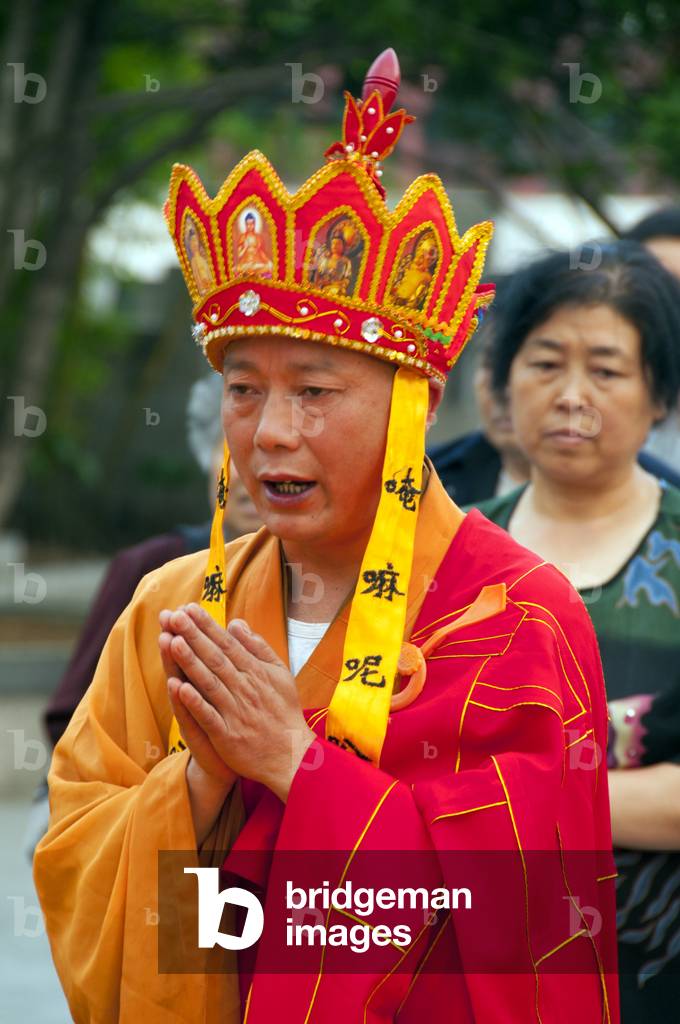 China: Elaborate late afternoon Buddhist rituals outside Ming-era Qianming Si (Qianming Temple), Guiyang, Guizhou Province