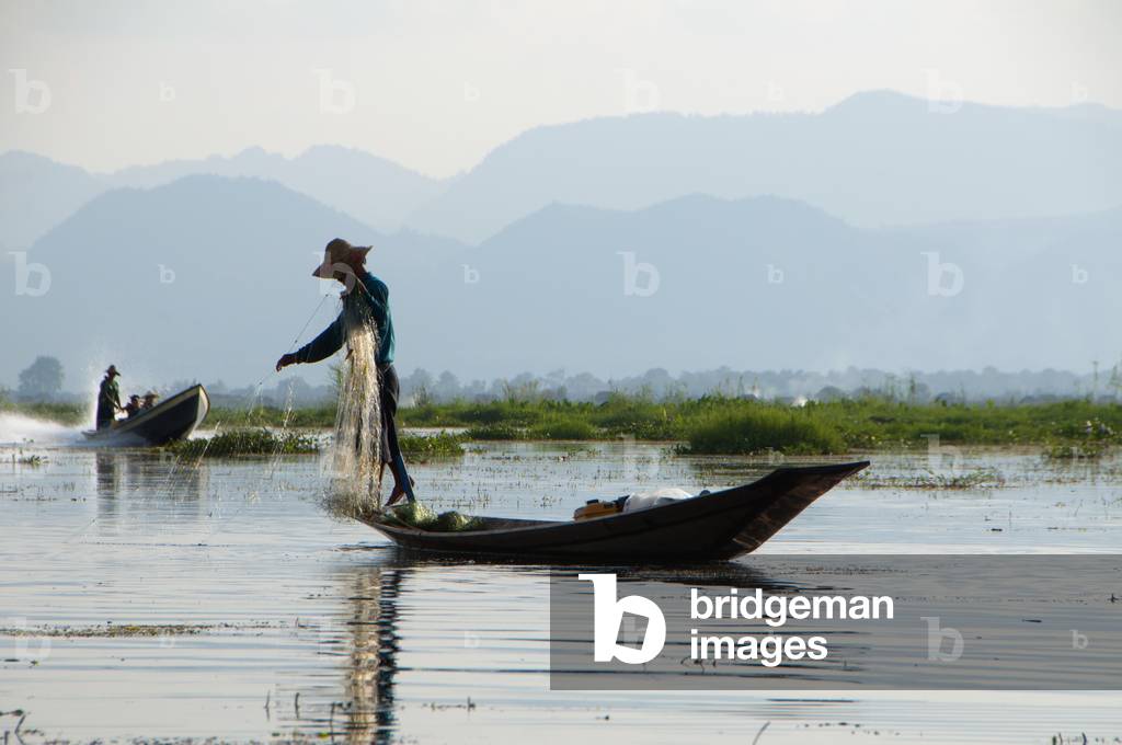 Burma / Myanmar: A leg rowing Intha fisherman on Inle Lake, Shan State